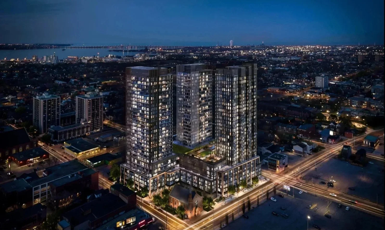 Aerial night rendering of The Design District condominium towers in Hamilton
